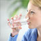 Young healthy woman drinking water